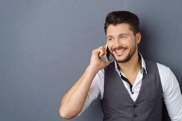 Young stylish smiling man talking on phone - Fotoğraf, Görsel