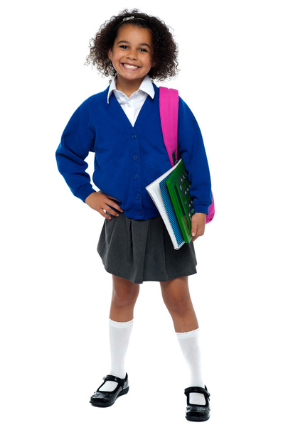 Girl in smart uniform holding notebook and calculator - Foto, immagini