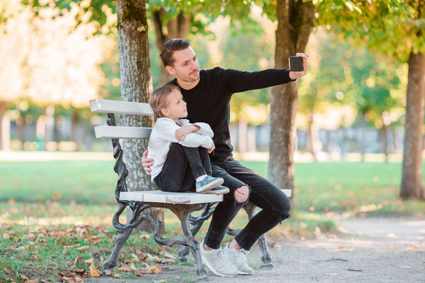 Happy family have fun taking selfie on beautiful autumn day - Photo, Image
