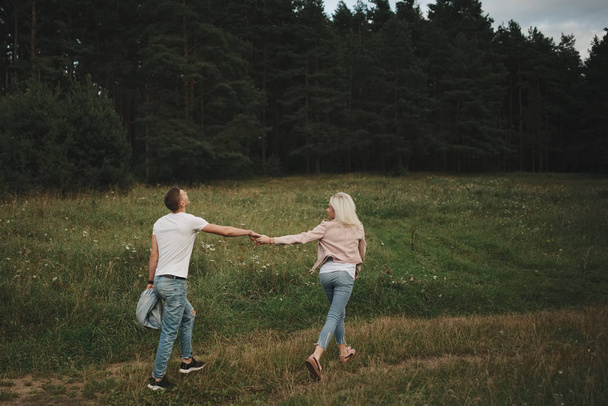 beautiful blonde girl with boyfriend - Valokuva, kuva