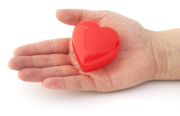 Ізольована руку з червоне серце - Фото, зображення