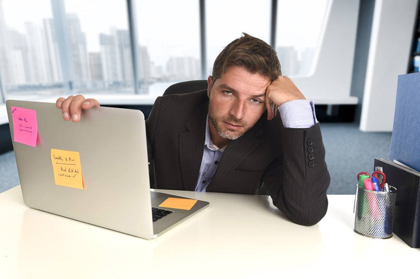 wasted businessman working in stress at office laptop computer looking exhausted - Photo, Image