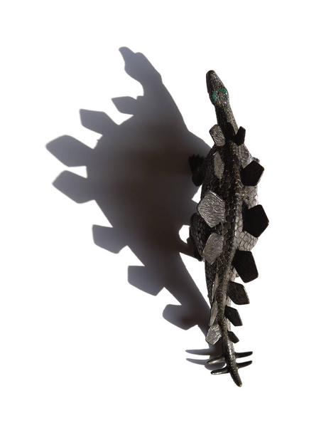 top view black stegosaurus toy with shadow on a white background - Photo, Image