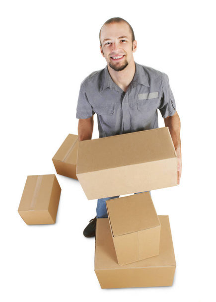 Cheerful handyman with boxes - Foto, Imagen
