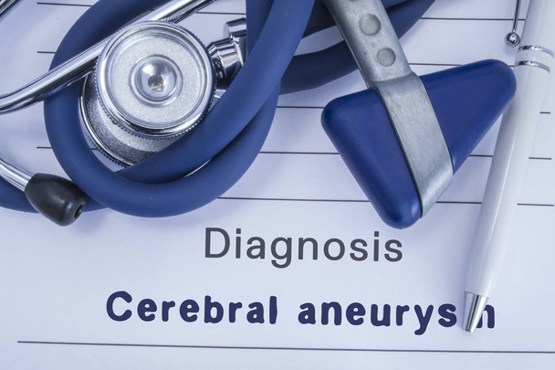 The diagnosis of Cerebral aneurysm. Paper medical history with diagnosis of Cerebral aneurysm, on which lie stethoscope, neurological hammer and pen. Medical concept for neurology and neuroscience - Photo, Image