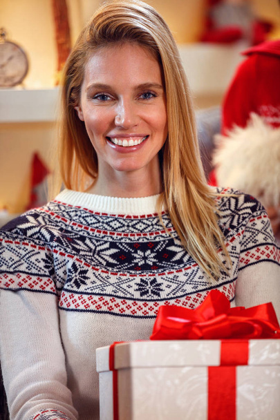 portrait of beautiful female with Christmas gift - Photo, Image