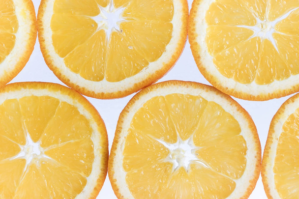Abstract background with citrus-fruit of orange slices. Close-up. Studio photography. - Foto, Bild