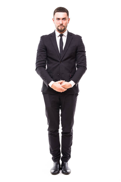 Confidence and charisma. Full length of smiling young bearded man in formalwear keeping hands crossed and looking at camera against white background - Valokuva, kuva