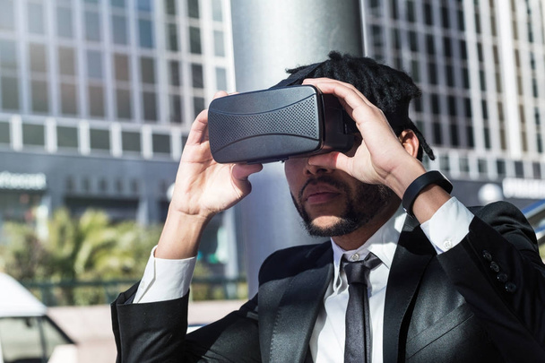 afro businessman playing virtual reality simulation - Valokuva, kuva