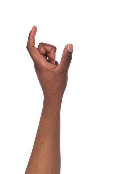 Male hand measuring something, cutout, gesture - Фото, изображение