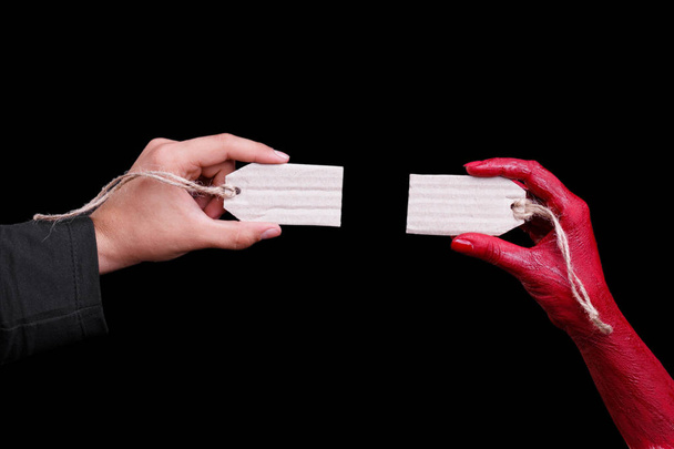 Human hands painted in red are posing on a black background. Halloween concept. - Photo, Image