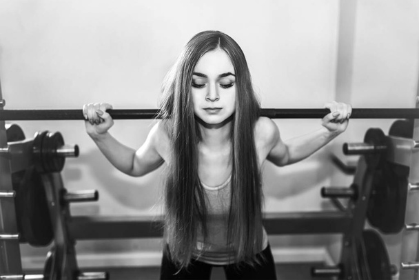 young woman training in gym - Photo, Image