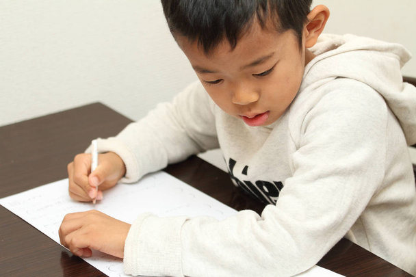 Japanese boy doing homework (first grade at elementary school) - Photo, Image