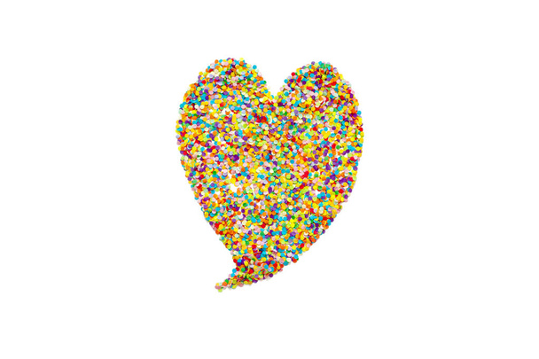 Heart made of colored confetti. Small circles of colored paper.  - Foto, immagini
