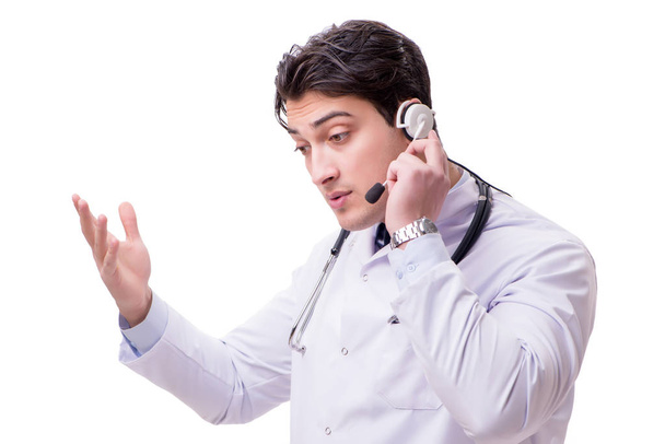 Молодой врач с телефонной гарнитурой изолирован на белом
 - Фото, изображение