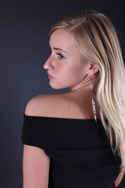 Portrait of the beautiful blonde on a black background - Fotografie, Obrázek
