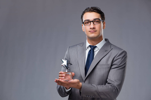Businessman holding star award in business concept - Foto, immagini