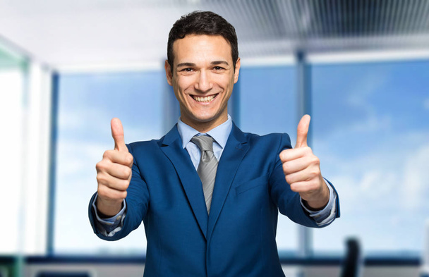 businessman showing thumbs up   - 写真・画像