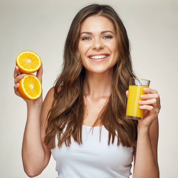 woman holding glass with orange juice - Φωτογραφία, εικόνα