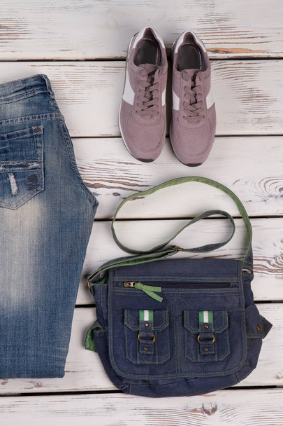 Jeans, sneakers and messenger bag - Photo, Image