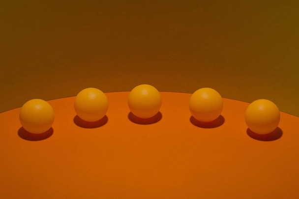 Abstract still life with orange balls on a colorful background - Photo, Image