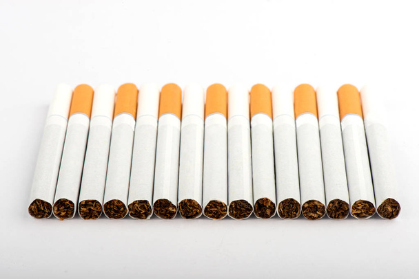 cigarette, cigarette on white background, pack of cigarettes, close-up of a cigarette - Photo, Image