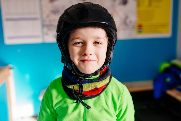 boy in helmet preparing for skiing - 写真・画像