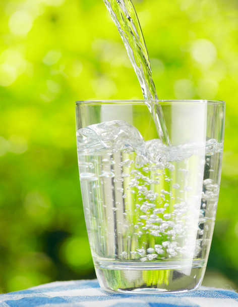 Glass of water on nature background - Zdjęcie, obraz