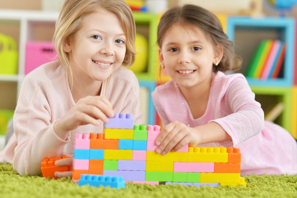 girls playing with colorful blocks - Foto, imagen