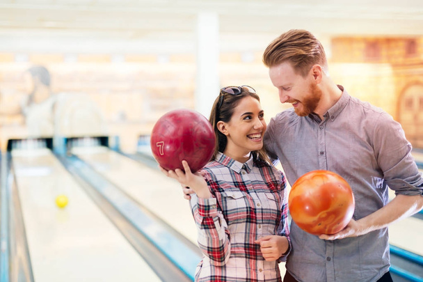 Couple enjoying bowling together - Фото, изображение