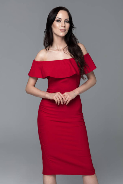 Beautiful woman in red dress - Fotó, kép