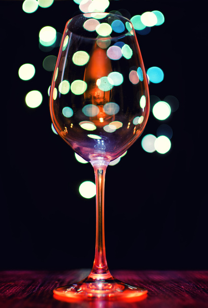 Empty wineglass on bokeh lights background - Foto, afbeelding