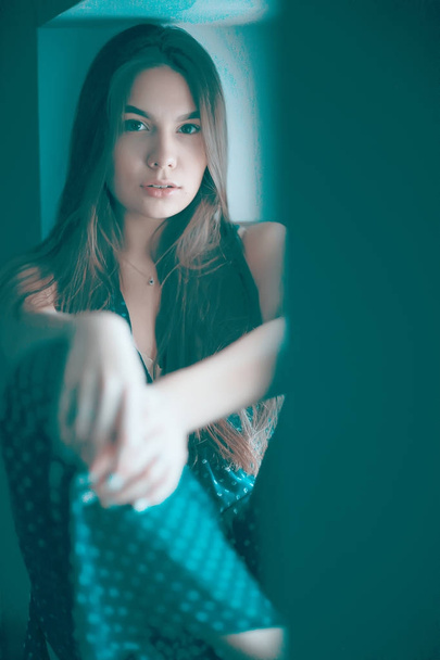 young woman on windowsill - Foto, Imagen