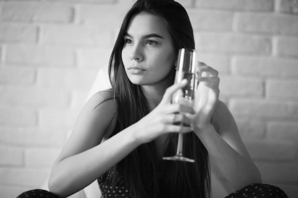 young woman with champagne - Fotó, kép