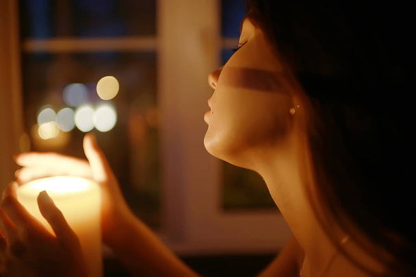 woman with burning candle - 写真・画像