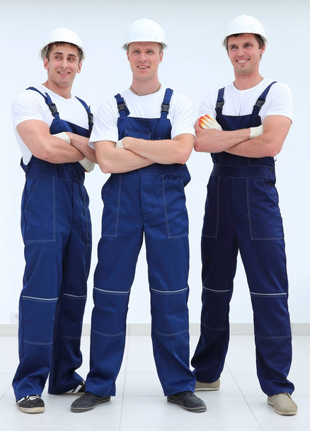 successful construction workers standing with arms crossed - Fotoğraf, Görsel