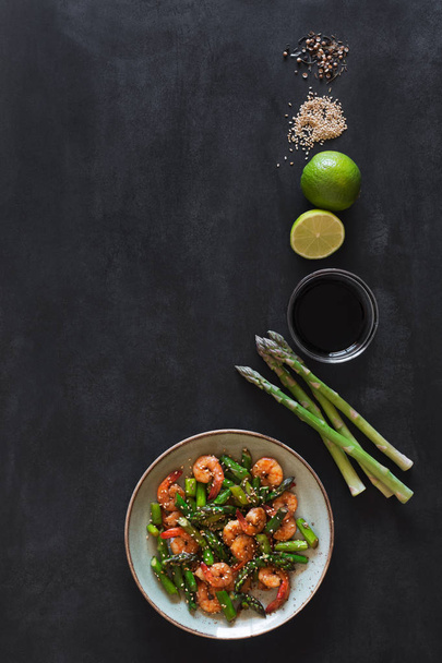 Salad with asparagus and shrimps in plate - Photo, image