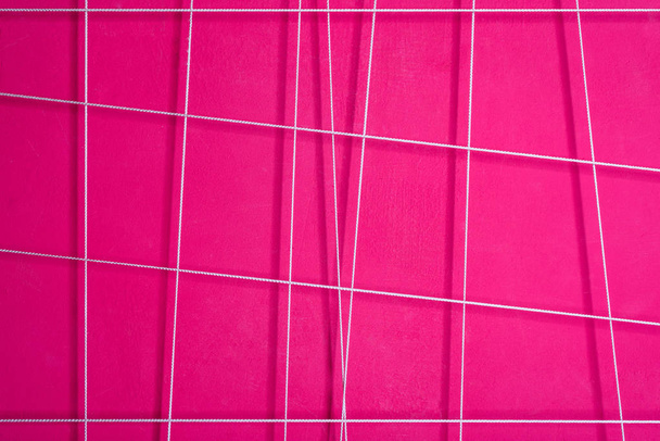 texture of a pink abstract wall with white geometric lines - Foto, Bild