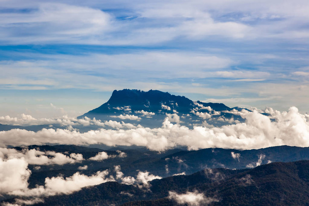 Mt Kinabalu in clouds at Borneo from mt Trusmadi summit - Foto, imagen