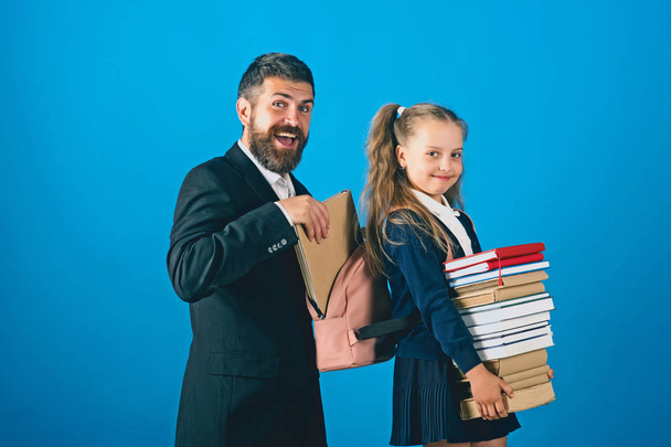 Home schooling and back to school concept. Kid holds books - Φωτογραφία, εικόνα