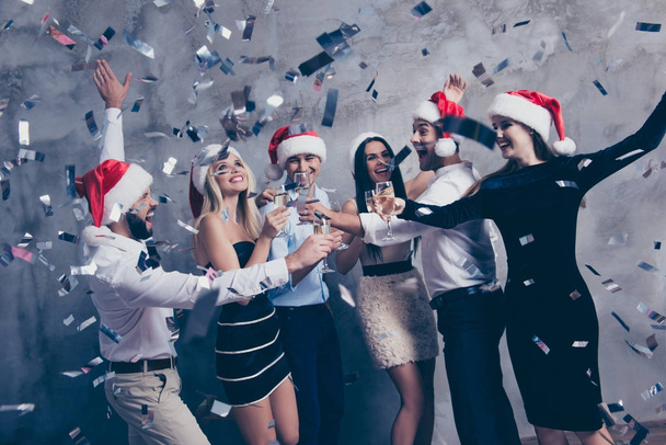 Celebrating newyear. Group of beautiful festive youth with stemw - Фото, изображение