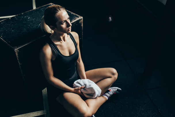 sportswoman on gym floor - Photo, Image