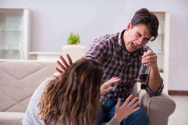 Domestic violence concept in a family argument with drunk alcoho - Photo, Image