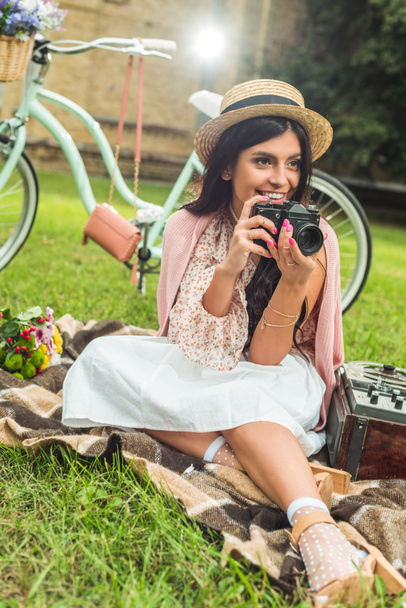 stylish girl with camera in park - Photo, image