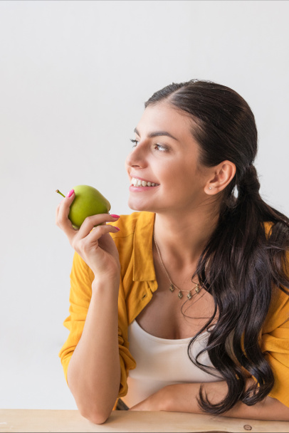woman with fresh apple - Фото, зображення