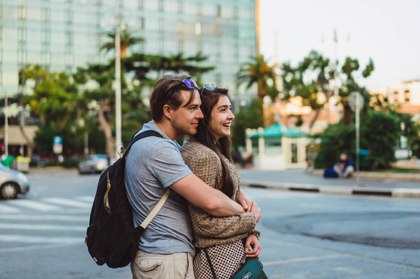 Couple hugging at urban scene - Φωτογραφία, εικόνα