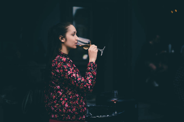 Young woman drinking wine - Foto, imagen