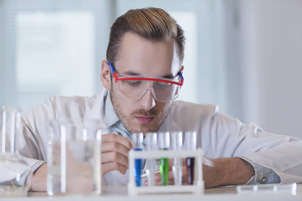 chemist with test tubes - Foto, Bild