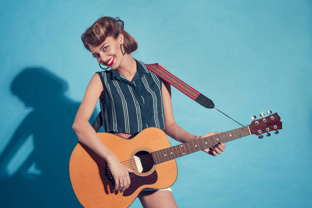 young woman playing guitar - Fotó, kép