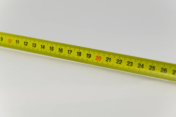 Gele Tape maatregel, Centimeter. Maatregel Tool apparatuur. Backgr - Foto, afbeelding